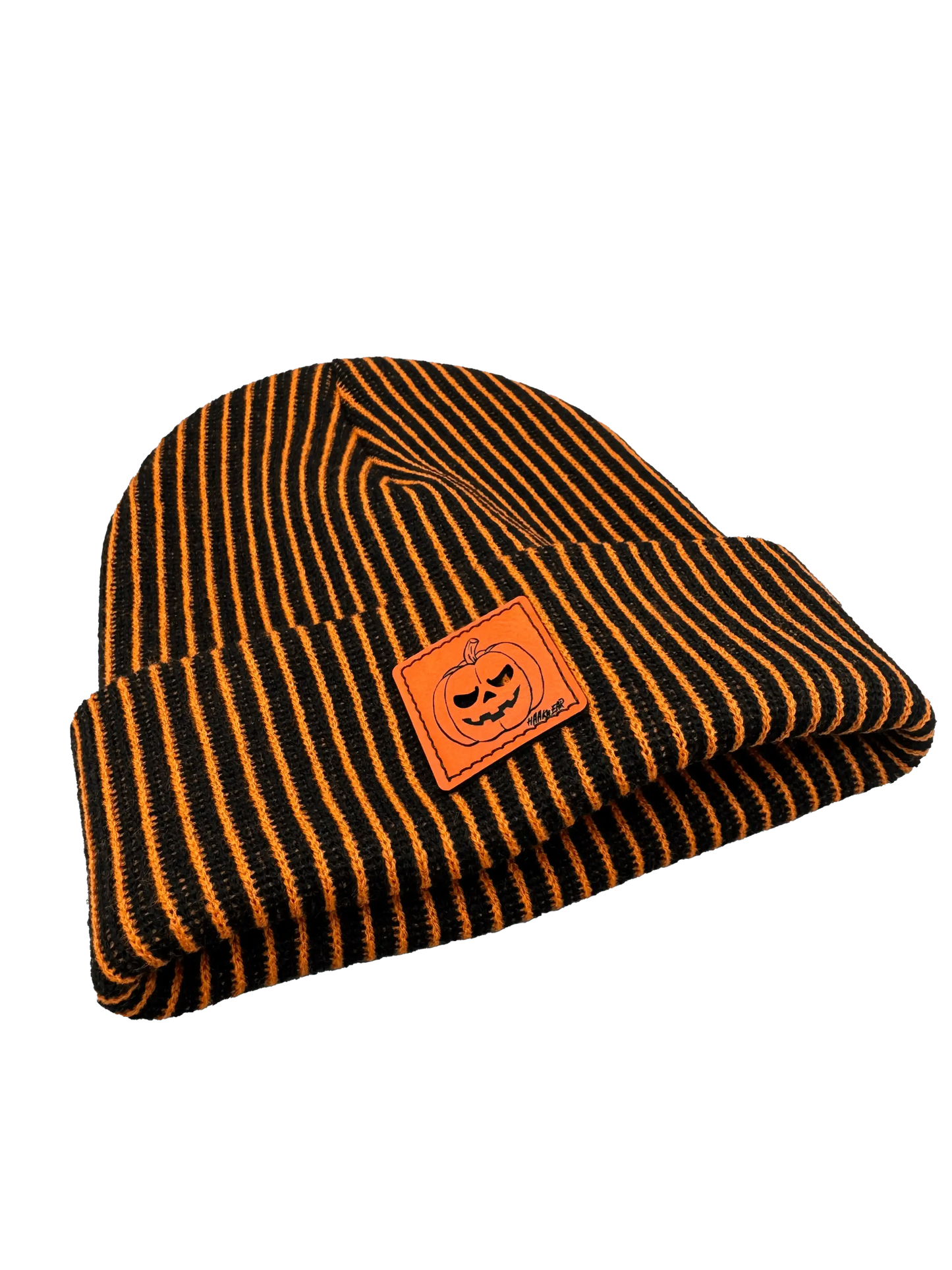 Striped knit beanie with orange pumpkin face patch and fold-over brim