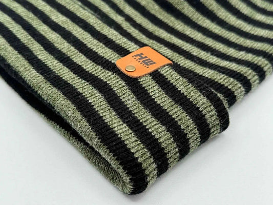 Cuffed knit beanie detail: black and green stripes with orange logo patch