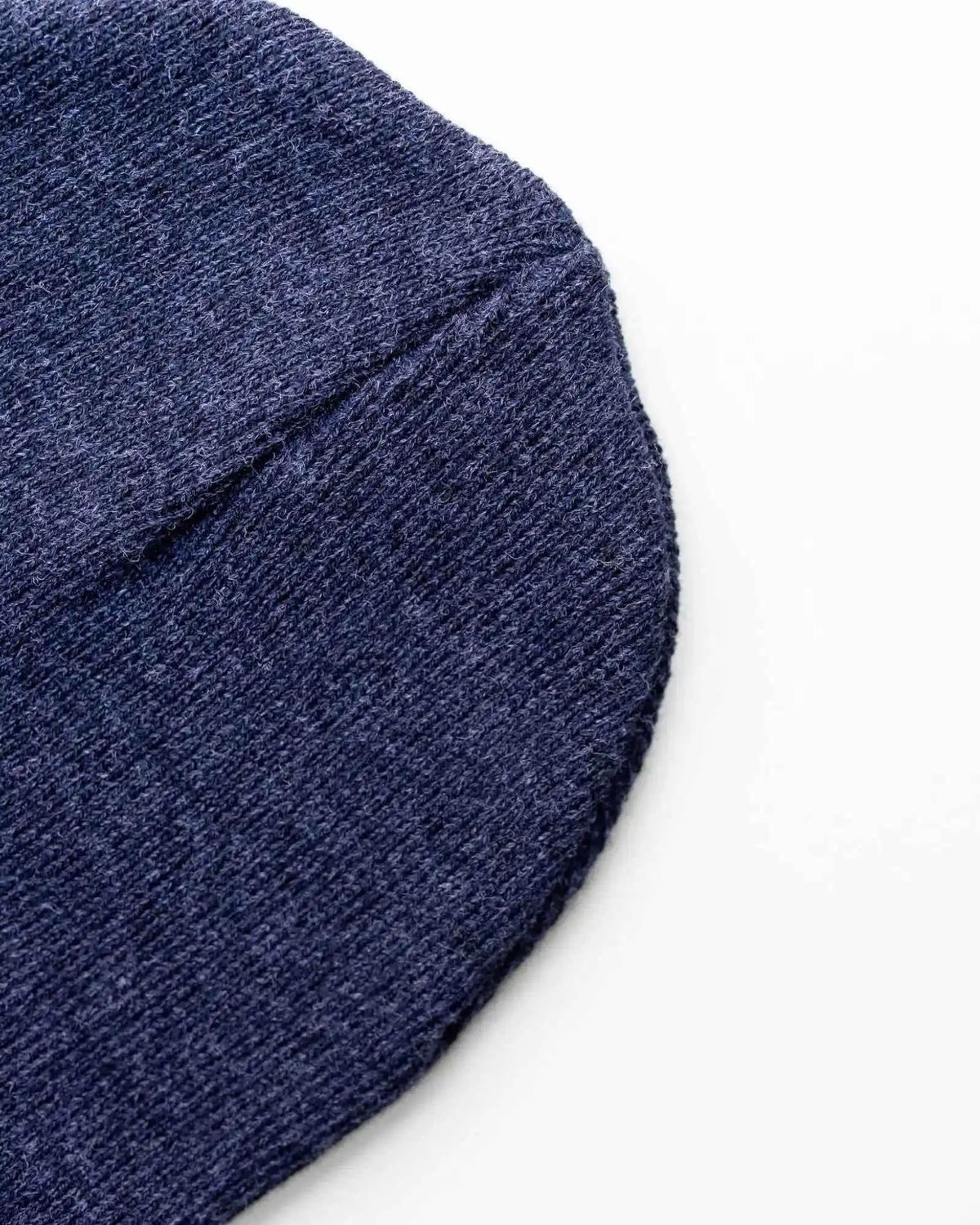 Denim blue knit beanie side view with folded cuff edge