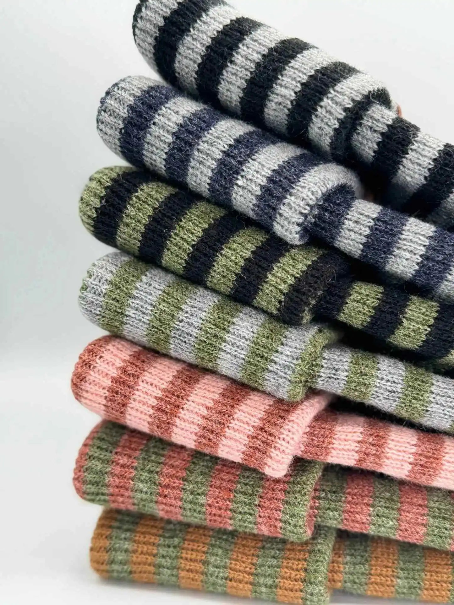 Stacked striped knit beanies with folded cuffs in multiple colorways