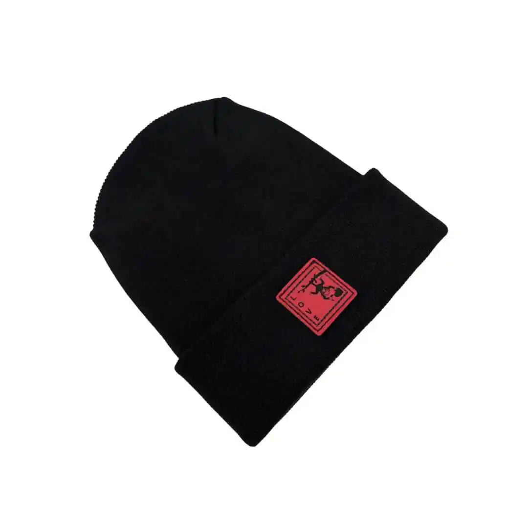 Black knit beanie with small red square logo patch on cuff