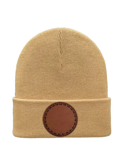 Beige knit beanie with folded cuff and round logo patch at the front.
