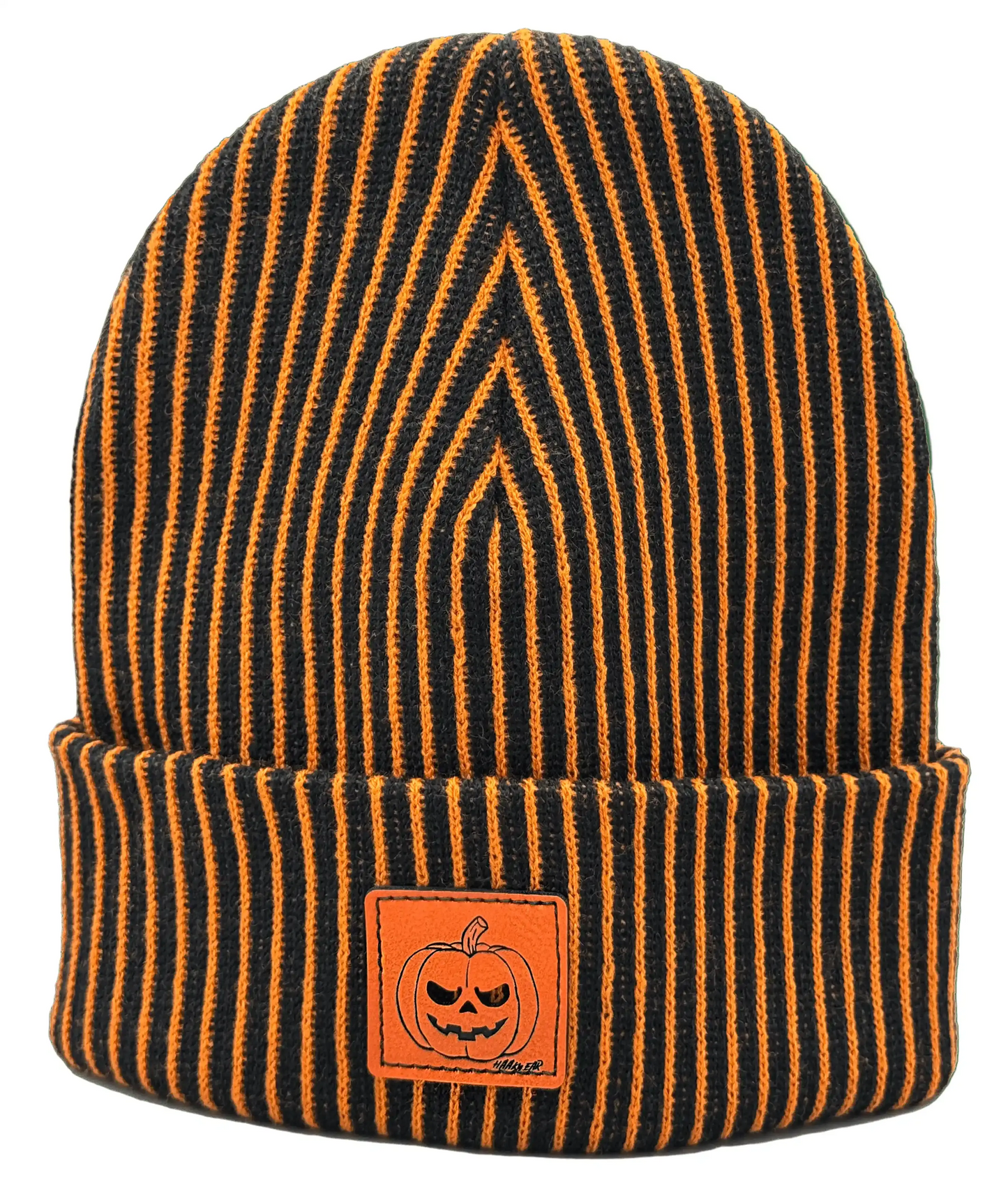 Striped knit beanie with orange pumpkin face patch, dark orange and black stripes