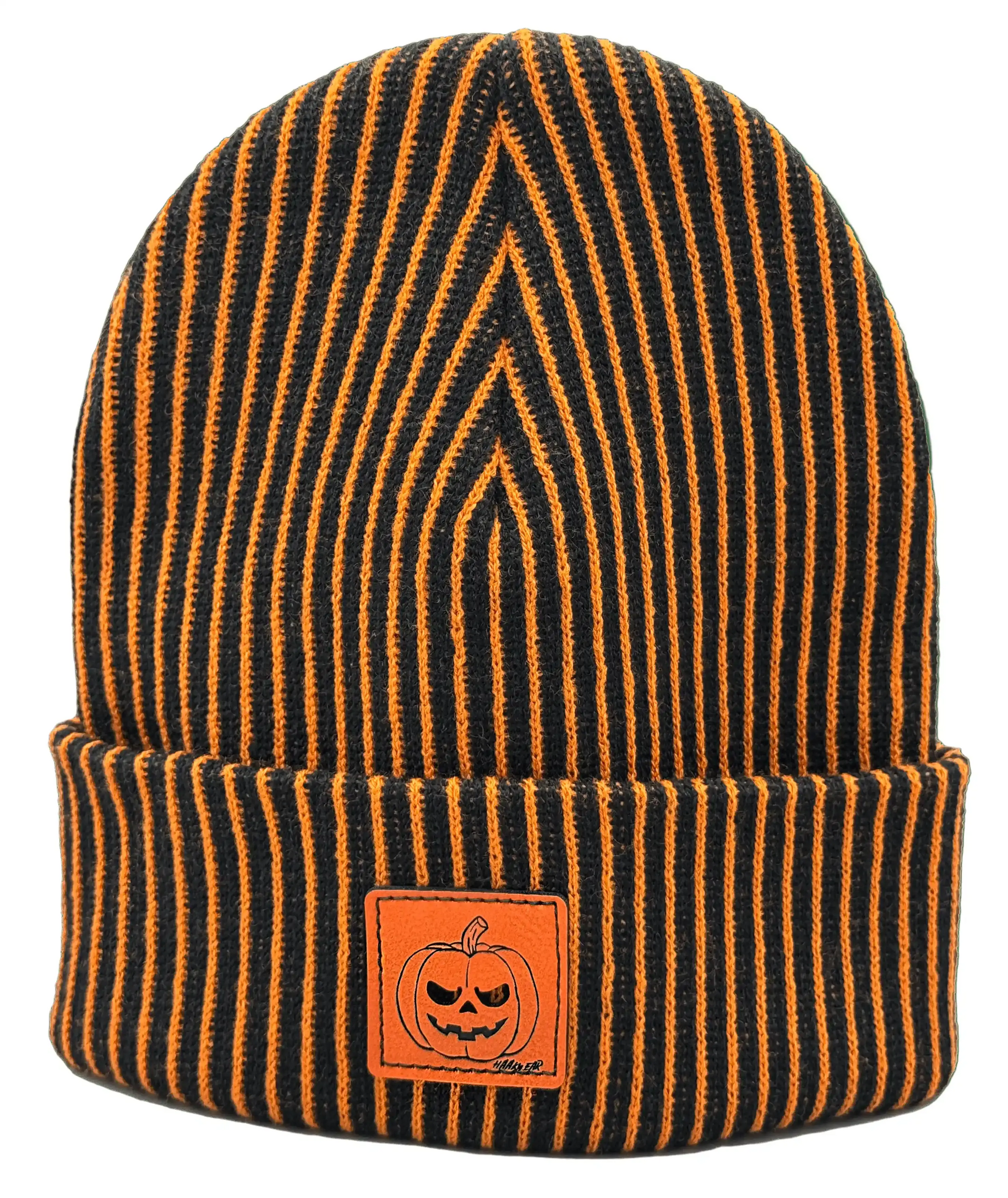 Striped knit beanie with orange pumpkin face patch, dark orange and black stripes
