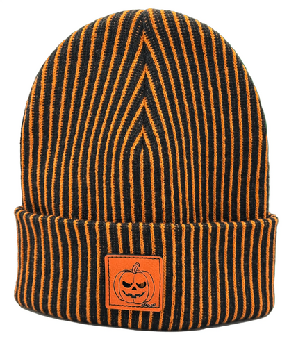 Striped knit beanie with orange pumpkin face patch, dark orange and black stripes
