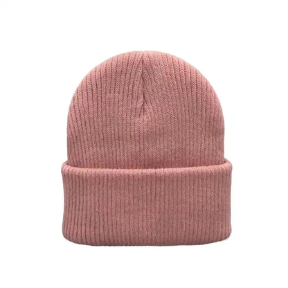Solid pink knit kids beanie with folded cuff and ribbed knit texture