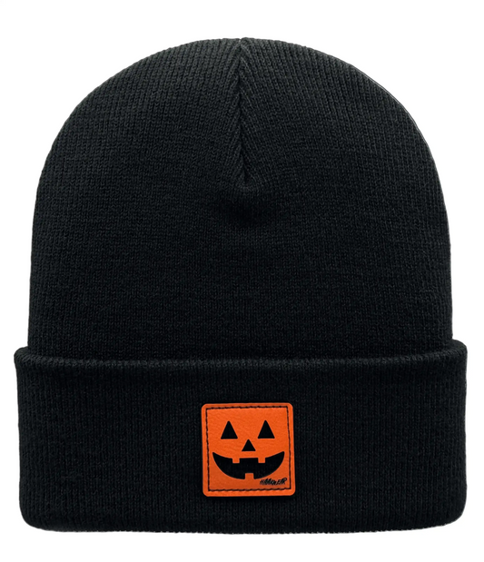 Black knit beanie with orange jack-o-lantern patch on the cuff