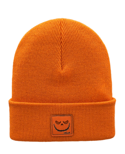 Orange knit beanie with jack-o-lantern patch on cuff