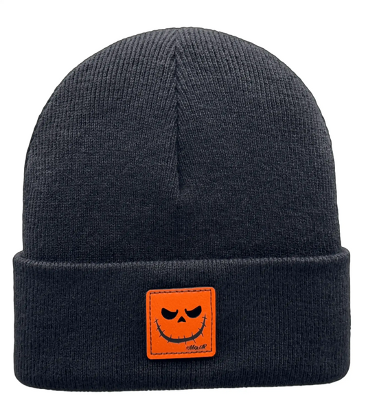 Halloween beanie with orange smiling jack-o-lantern patch on dark knit cuff