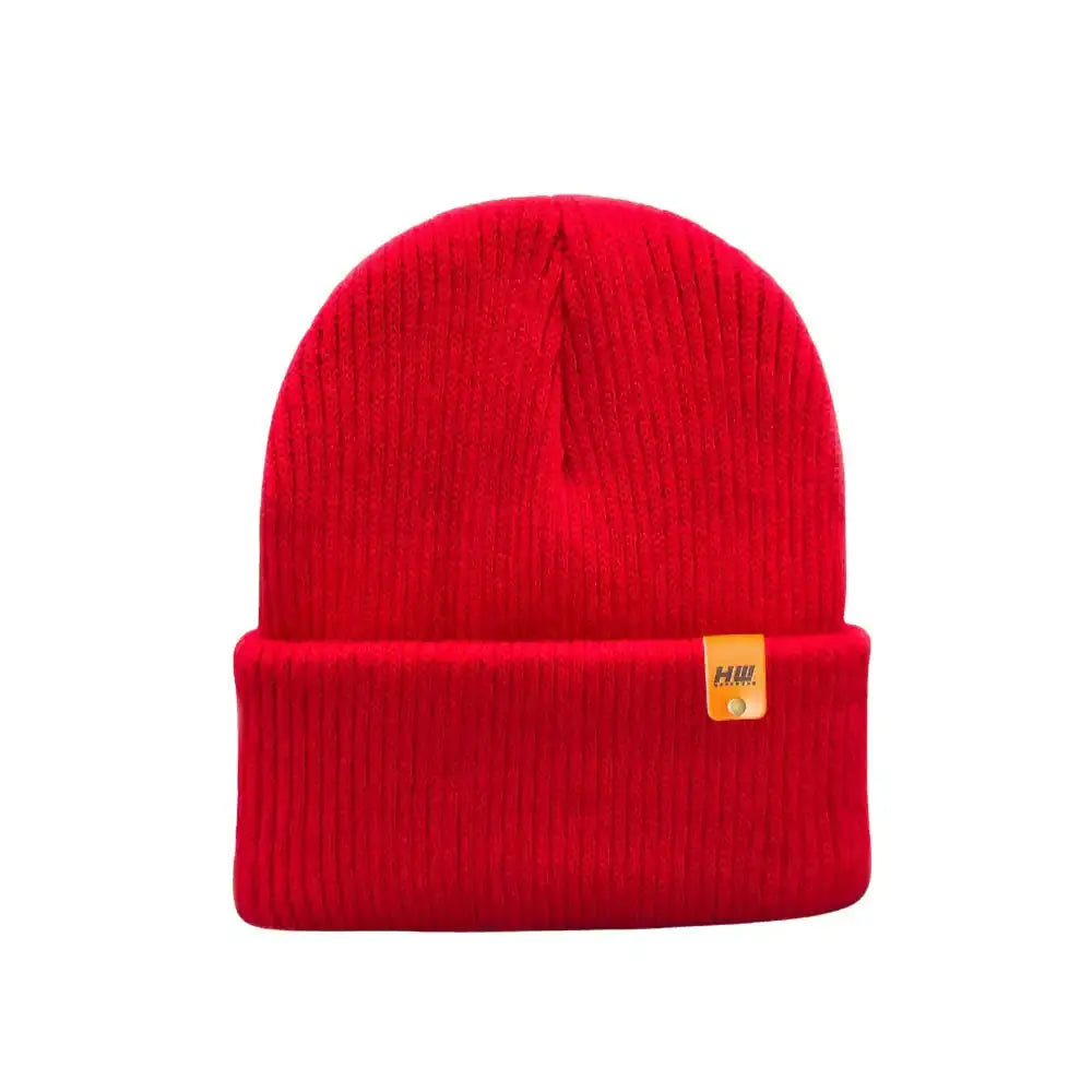 Kids knit beanie in red with ribbed cuff and small yellow logo patch