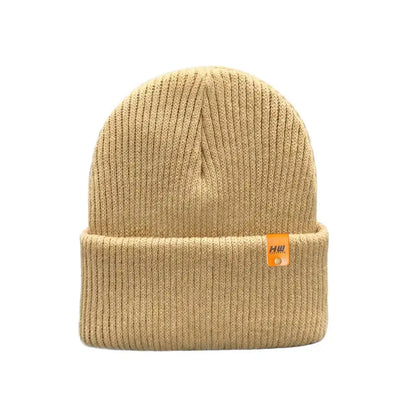 Kids cuffed knit beanie in beige with small logo tag on cuff