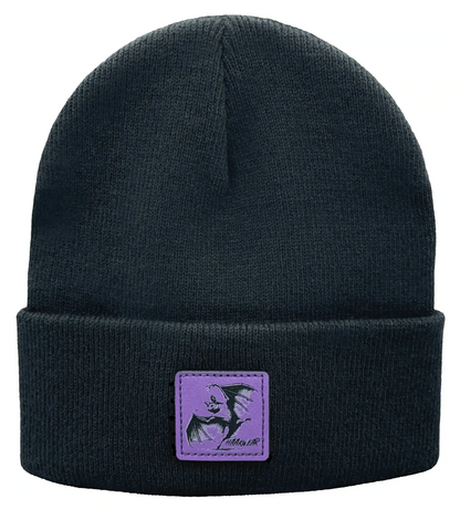 Dark knit beanie with purple rectangular wing logo patch at the cuff