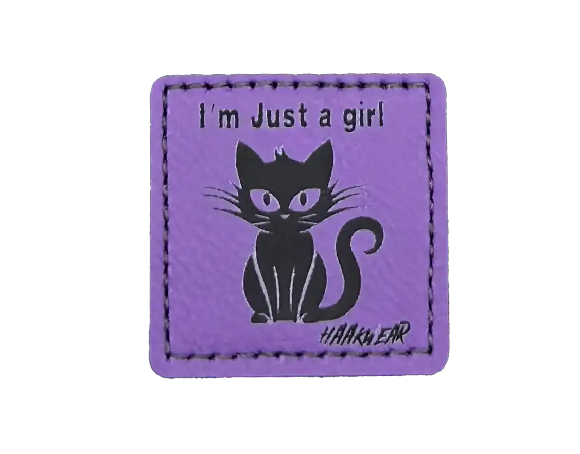 Purple stitched cat patch with "I'm Just a girl" text and cat graphic.