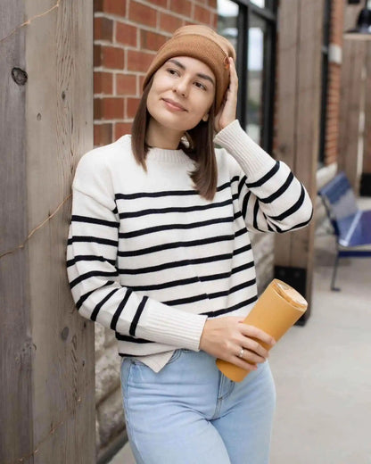 Camel brown cuffed knit beanie on model, ribbed knit and folded brim