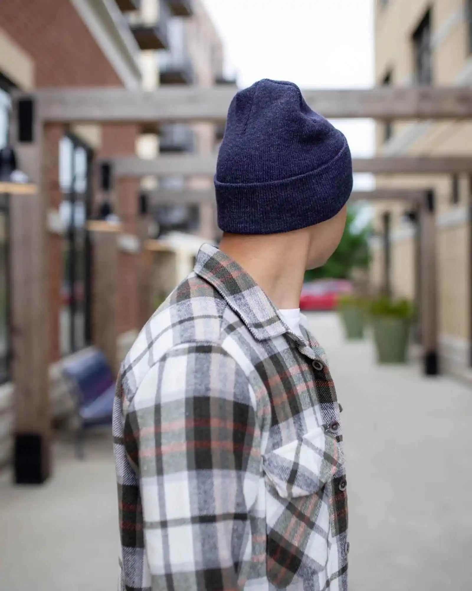 Denim blue cuffed knit beanie with tan logo patch