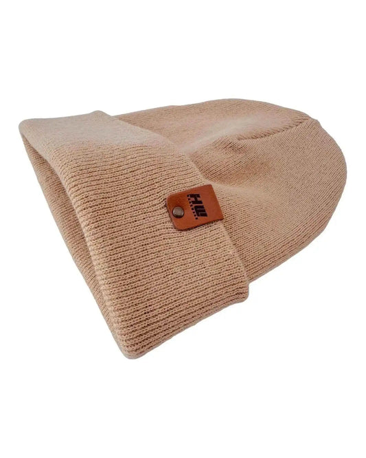 Dune beige knit beanie with cuff and rectangular brand patch detail