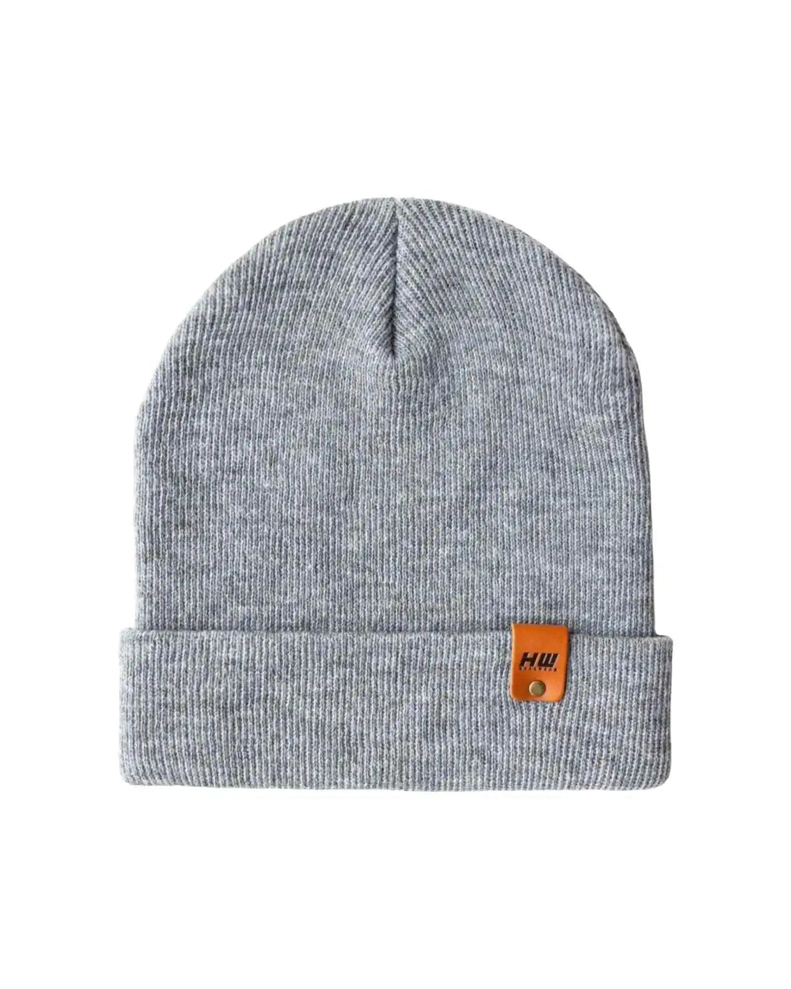Gray knit cuff beanie with folded brim and small brown logo patch