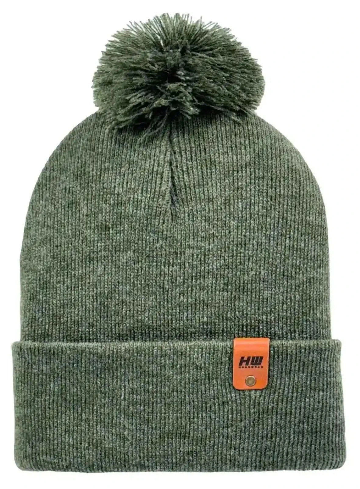 Forest green knit beanie with folded cuff and large pom-pom, small leather patch