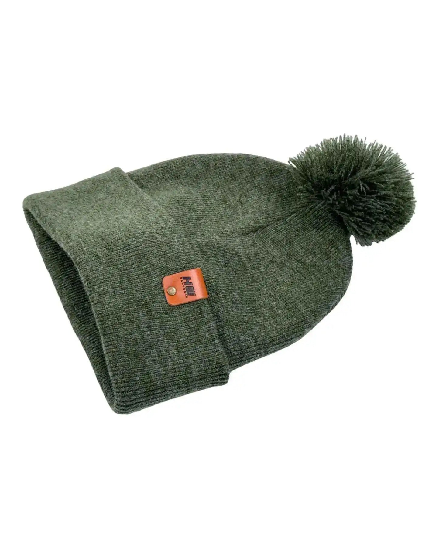 Forest green knit beanie with cuff fold and large pom pom, orange logo patch