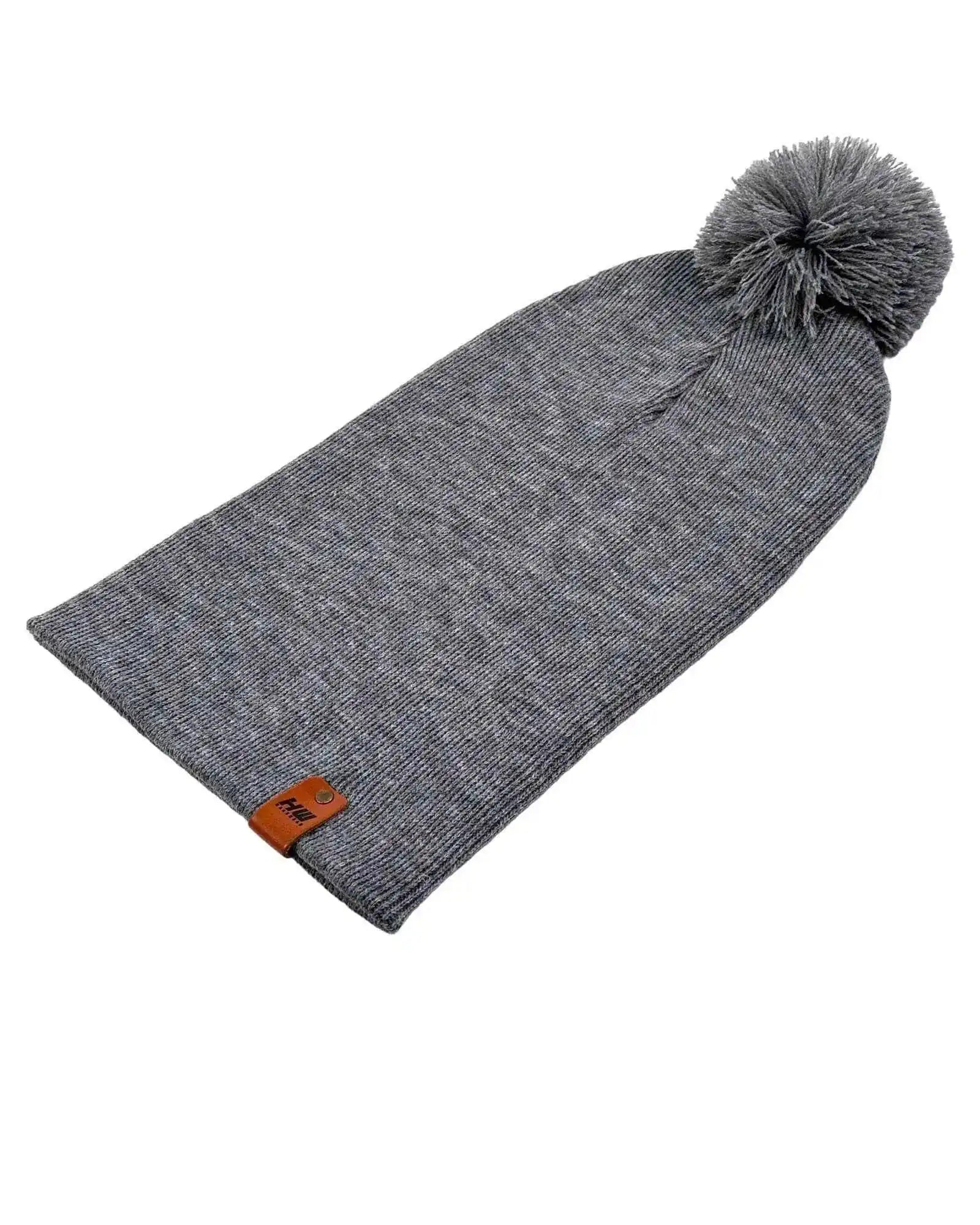 Gray knit beanie with cuff, side logo patch, and gray pom pom on top