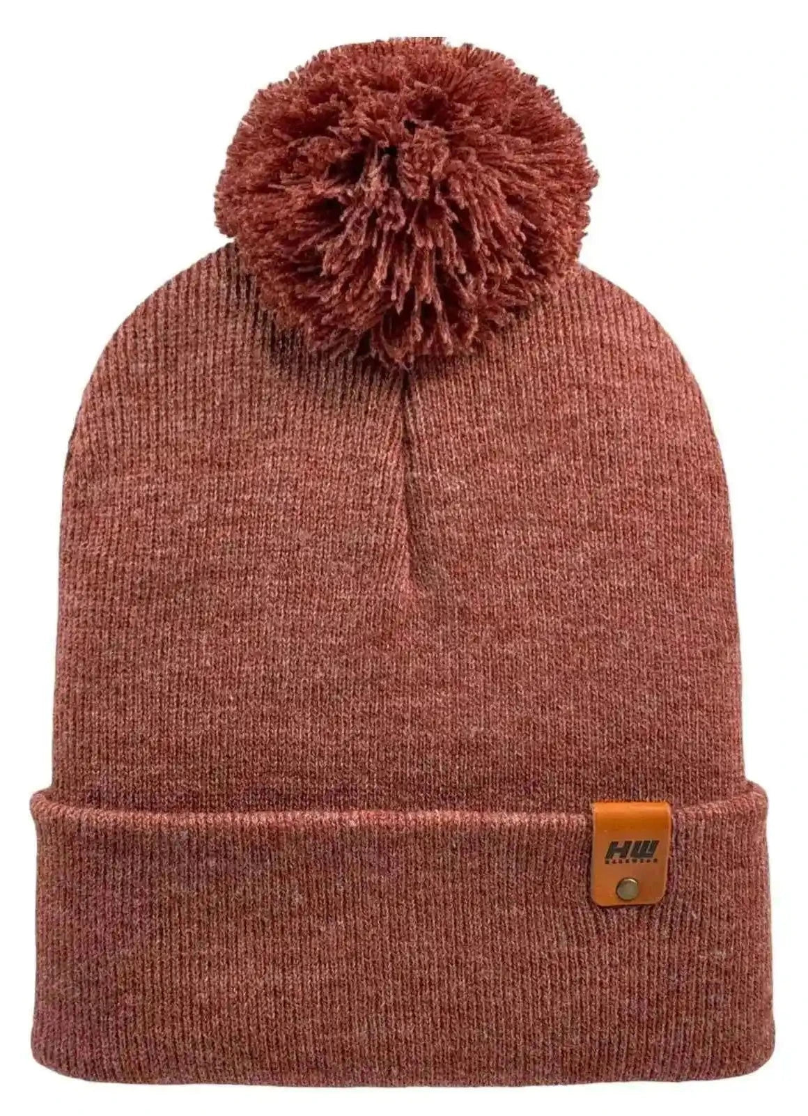Rusty burgundy knit beanie with folded cuff, large pom pom, and logo patch