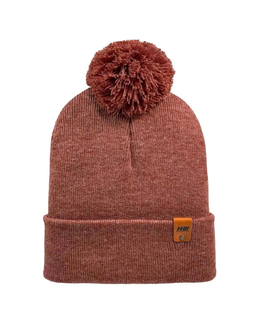Rusty burgundy knit cuff beanie with pom pom and small logo patch