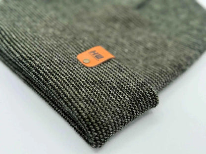 Knit beanie cuff corner with orange brand label patch