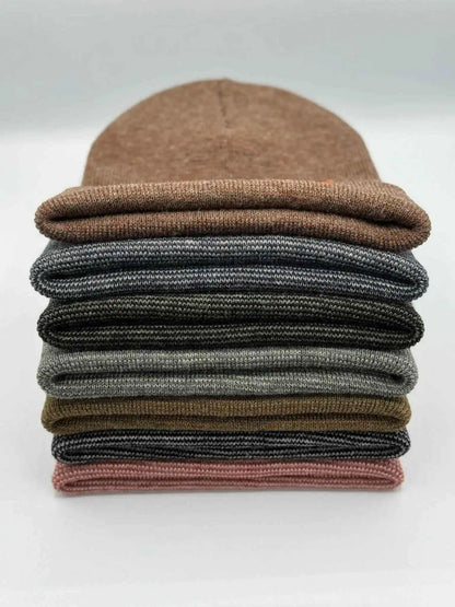 Stack of ribbed knit cuff beanies in mixed colors