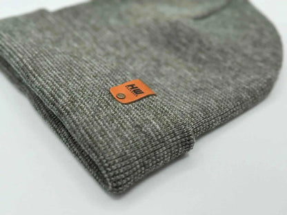Gray knit beanie cuff with orange rectangular brand patch detail