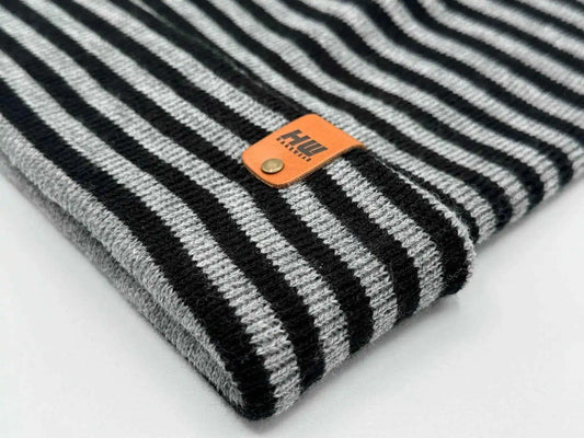 Striped knit cuff beanie with orange logo leather patch