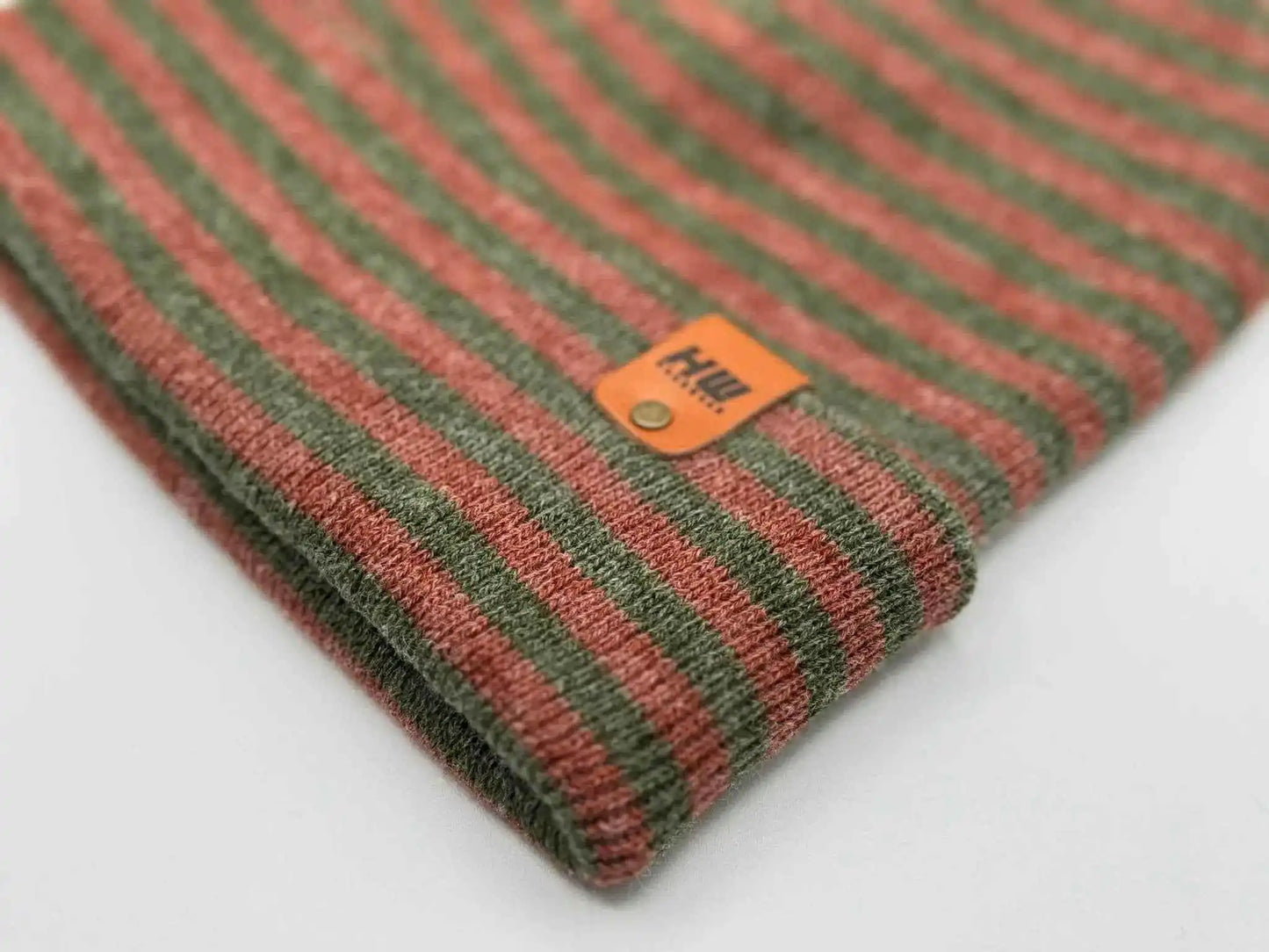 Cuffed beanie with label patch on burgundy-and-green striped knit