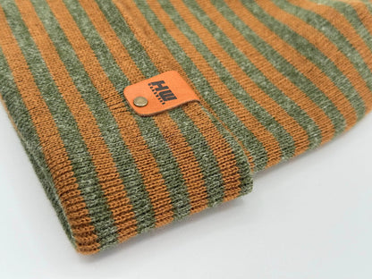 Striped knit cuff beanie with leather brand patch detail at folded edge
