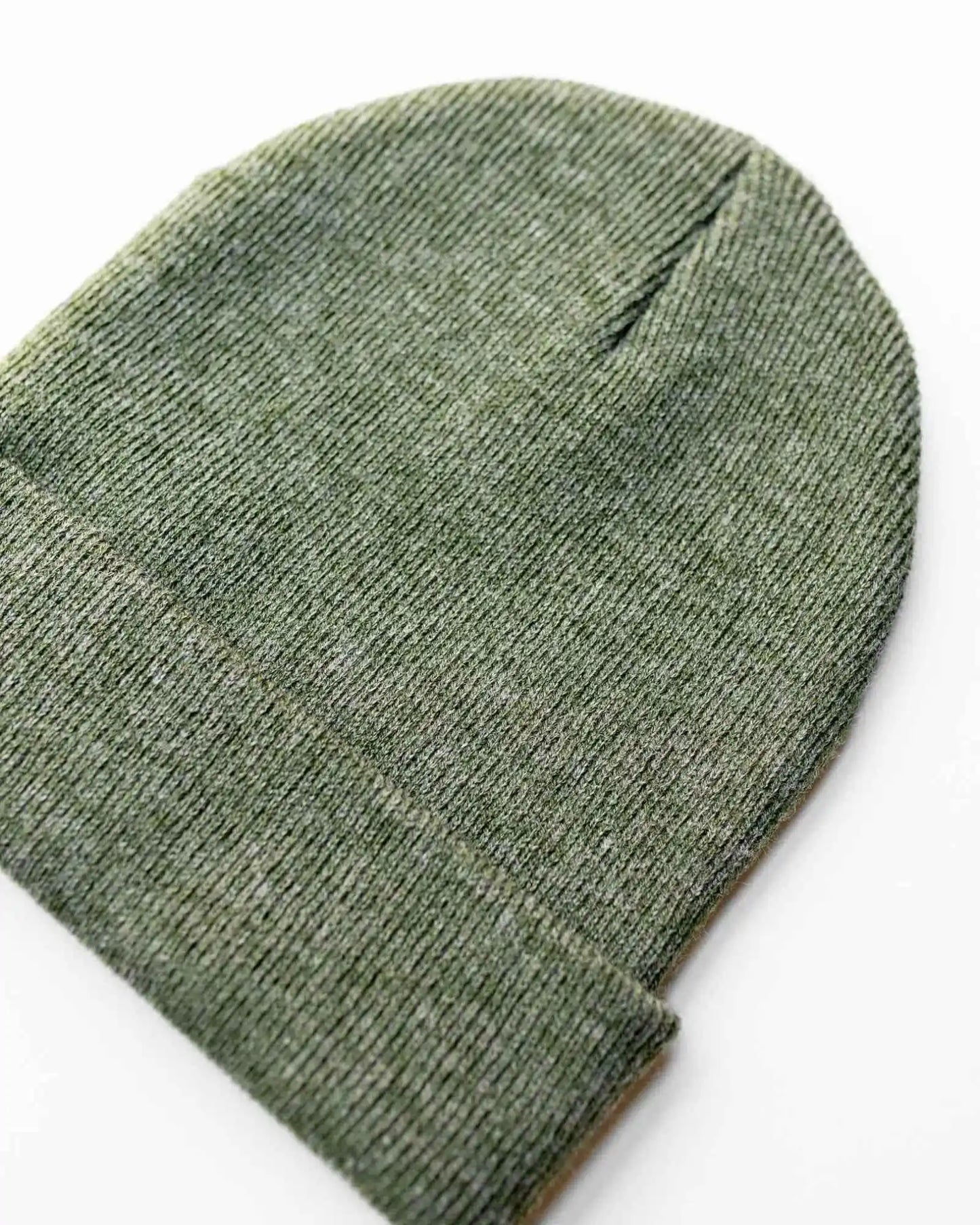 Forest green beanie with ribbed knit texture and folded cuff