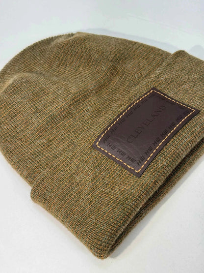 Brown knit beanie folded cuff with Cleveland logo patch and stitched border