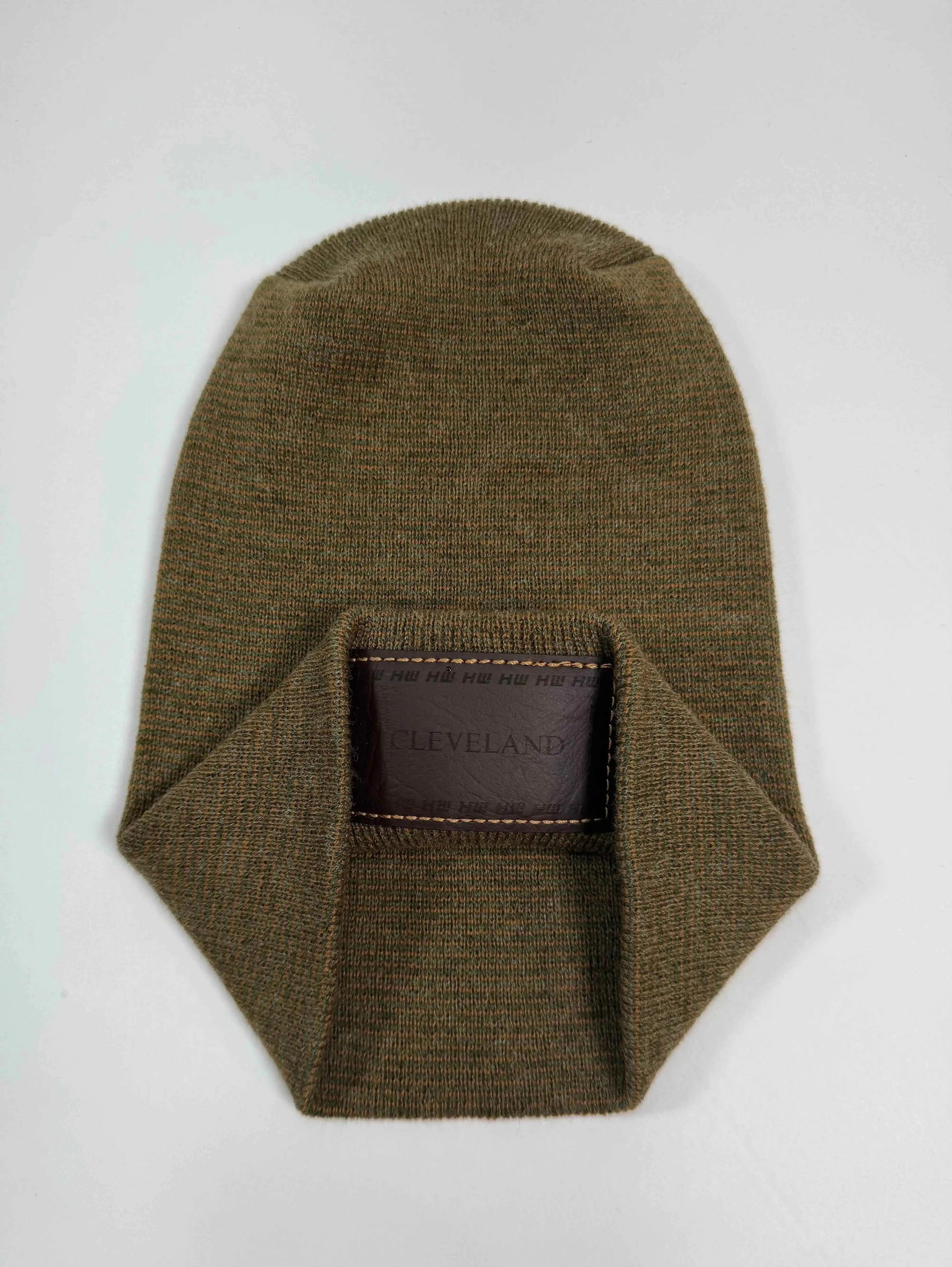 Brown knit beanie with folded cuff and stitched Cleveland patch at center front