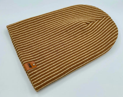 Folded beige and brown striped rib beanie with leather logo patch on cuff, knit texture