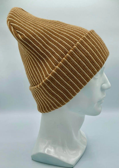 Beige and brown ribbed striped beanie with folded cuff, side view, leather logo patch