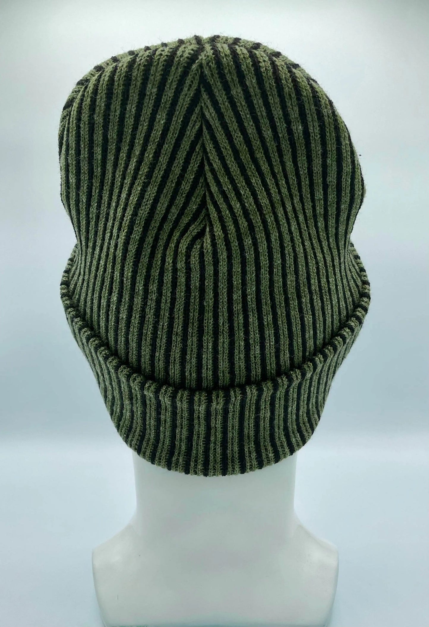 Green ribbed striped beanie with wide cuff, rounded top with vertical seam detail