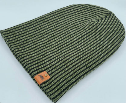 Green ribbed striped beanie with wide cuff and brown leather label near hem