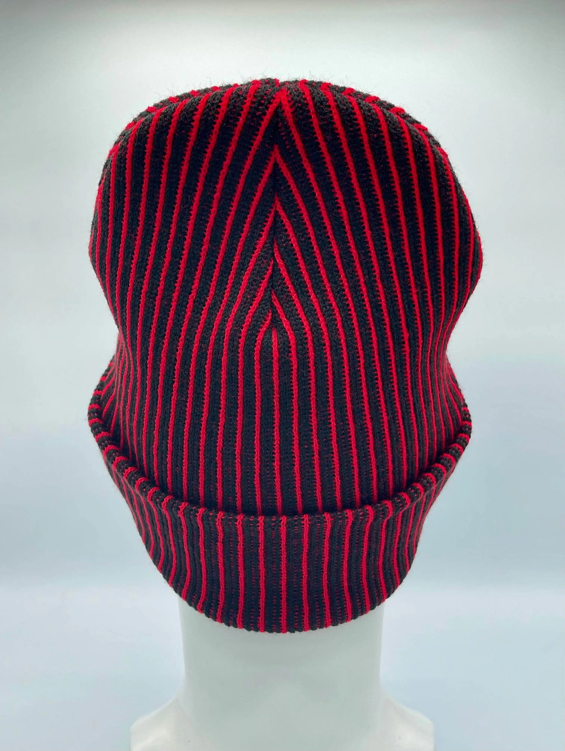 Cuffed wide ribbed beanie in black with red vertical stripes, rear view