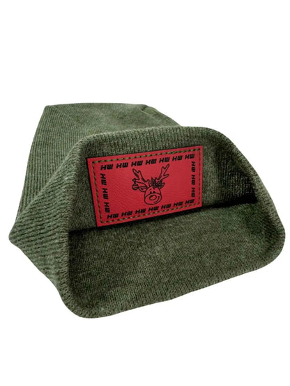 Olive knit beanie with red reindeer patch reading 'HU HU HU'