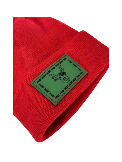 Red knit beanie with green reindeer label patch on cuff, angled