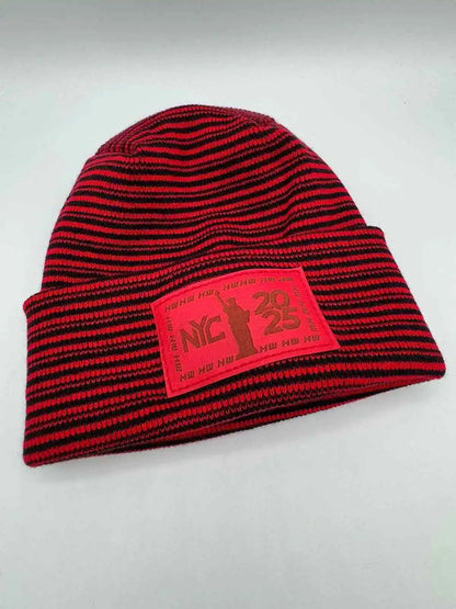 Cuffed beanie in red and black striped knit with front NYC 25 logo patch