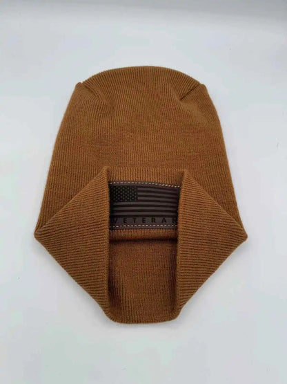 Medium brown knit cuffed beanie with rectangular Veteran flag patch.