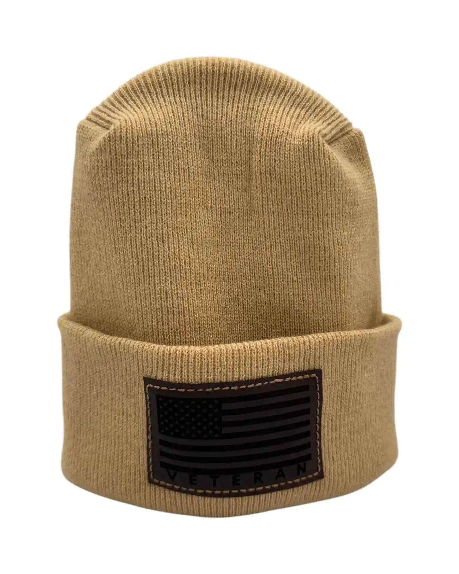 Cuffed knit beanie in tan/beige with a dark Veterans flag patch on the front cuff