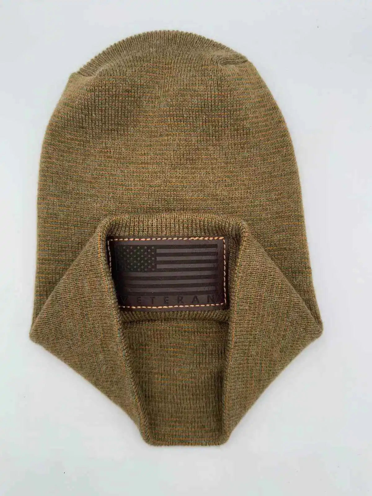 Olive knit cuffed beanie with rectangular Veteran patch on cuff.