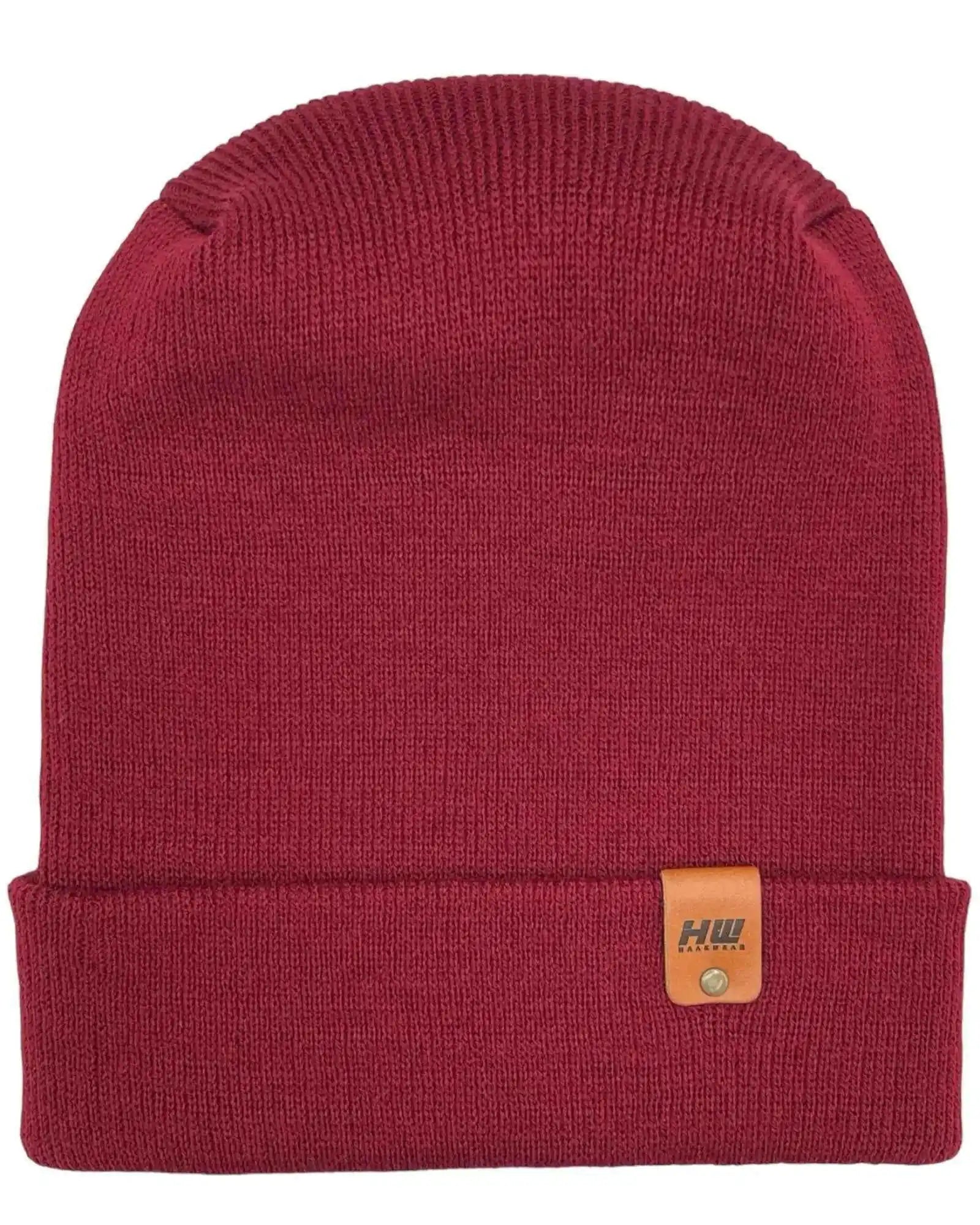 Maroon ribbed knit beanie with folded cuff and small brown logo patch.