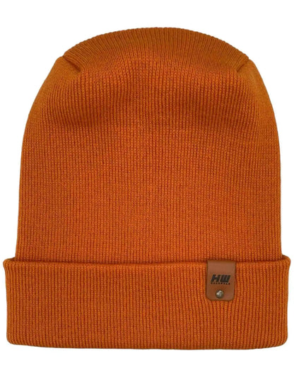Orange knit beanie with folded cuff and small leather-look logo patch