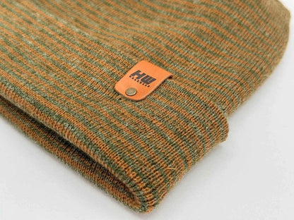 Brown and green contrast beanie with ribbed knit and orange logo patch on cuff