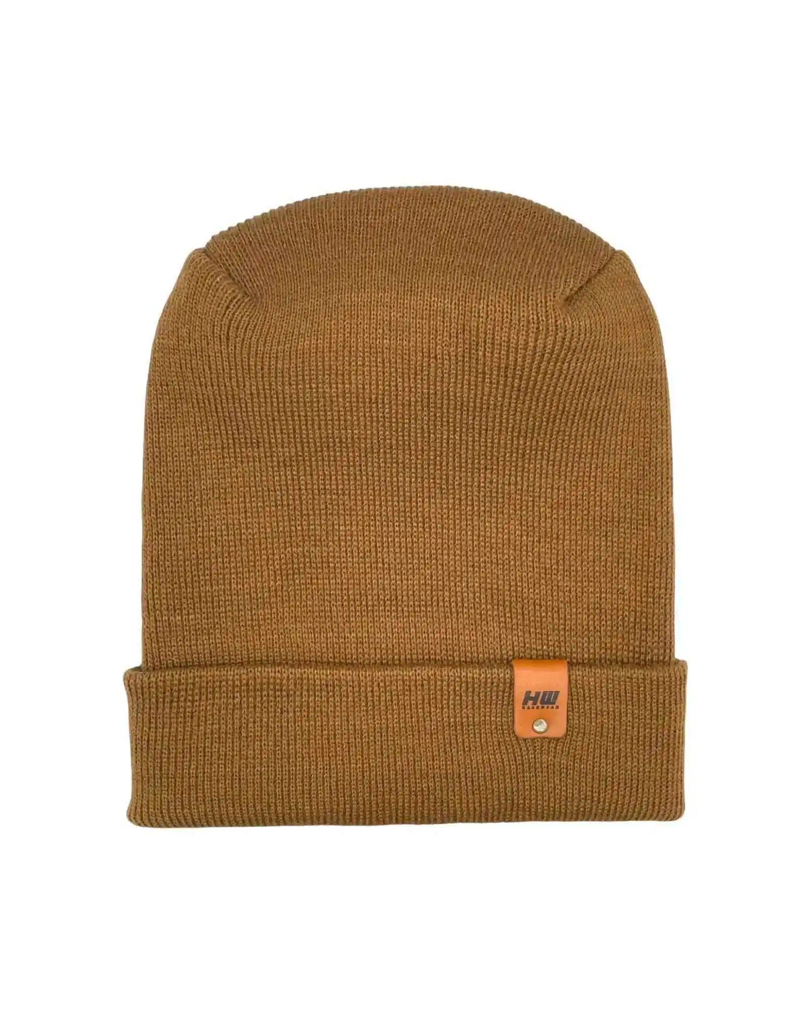 Camel brown knit beanie with folded cuff and small logo patch on front